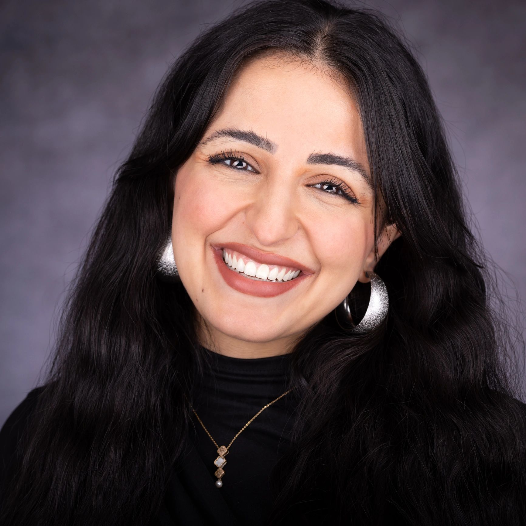 Headshot of a smiling yoga instructor