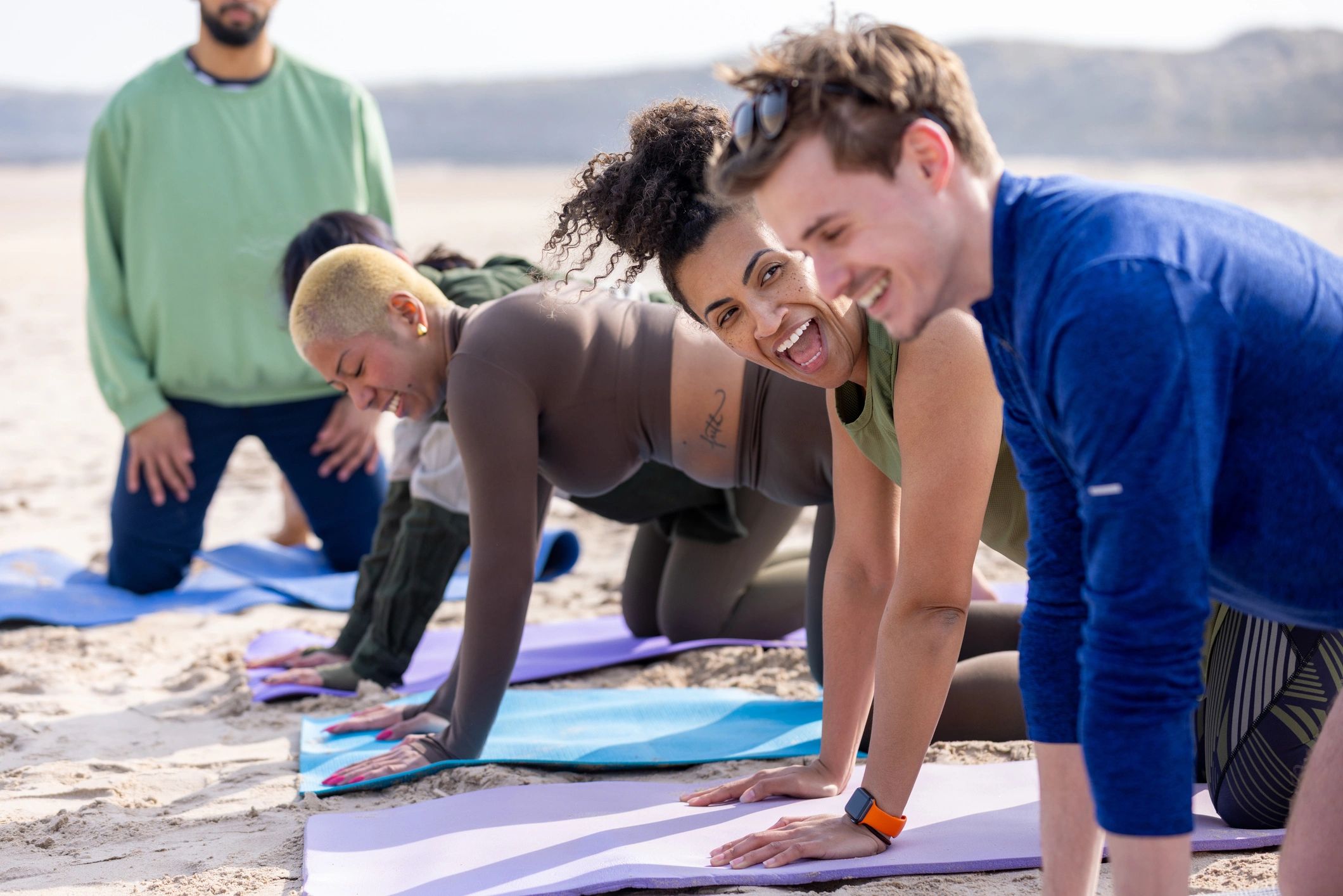 Group yoga class stretching together